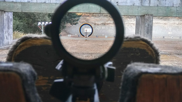 aligning center of crosshairs to center of bore;