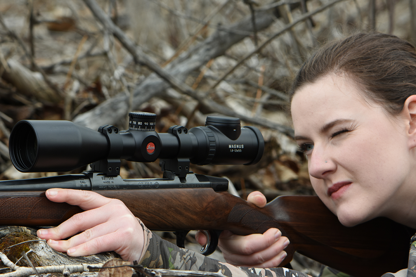 Young lady shooting CZ557 with Warne Scope Mounts for Leica Scope